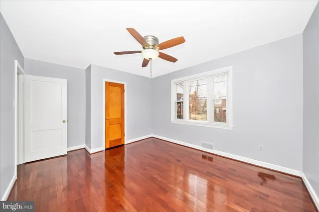 a view of a room with wooden floor