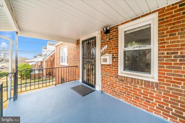 a view of an entryway with wooden floor and door