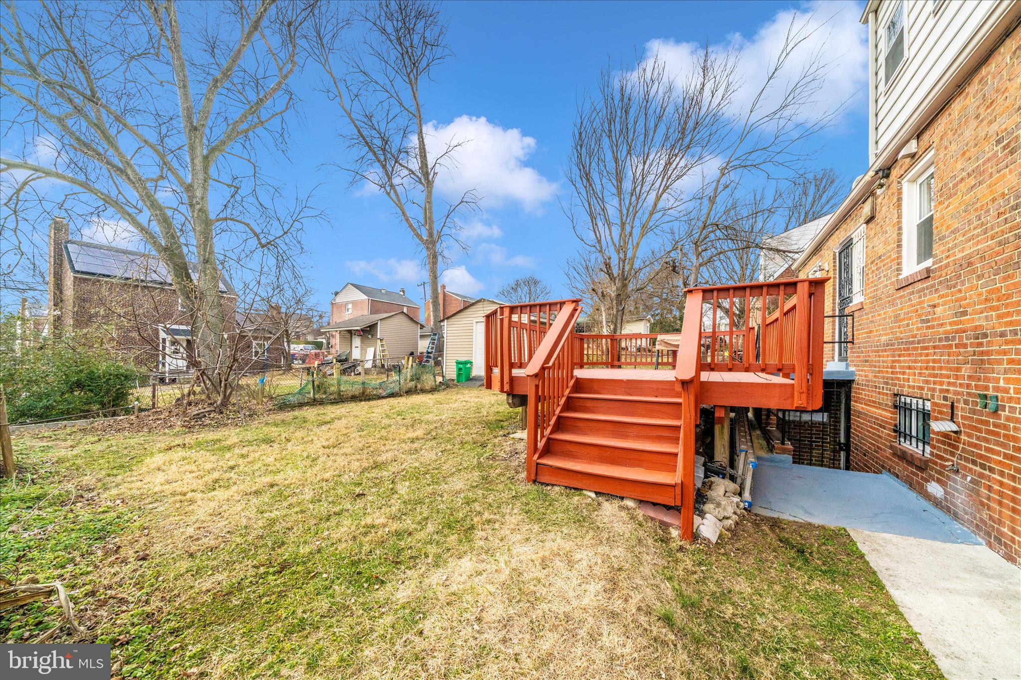 821 Rittenhouse Street Hyattsville, MD 20783 - Photo 49 of 59 a backyard of a house with wooden fence and large trees