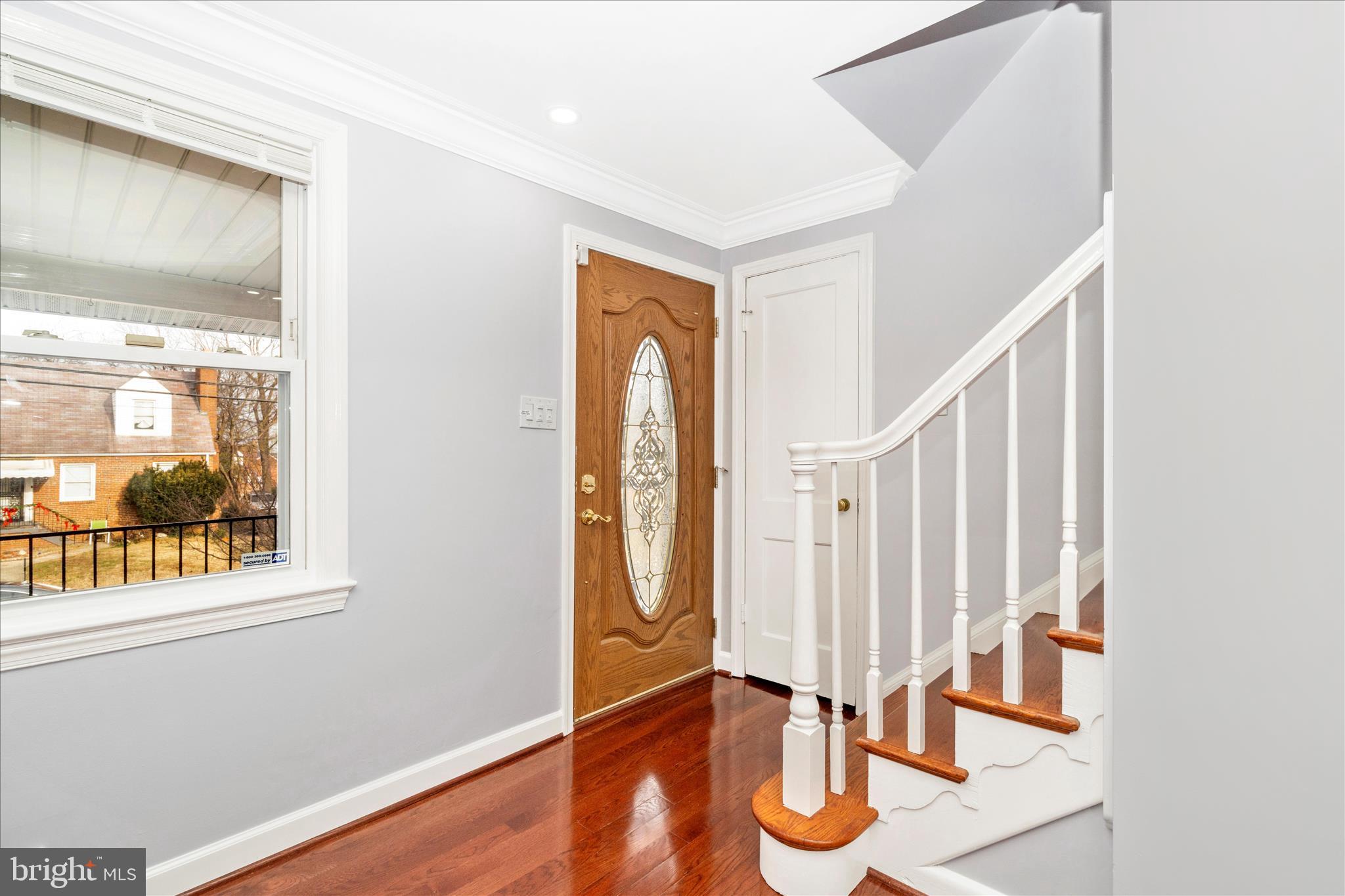 821 Rittenhouse Street Hyattsville, MD 20783 - Photo 5 of 59 a view of an entryway with wooden floor and door