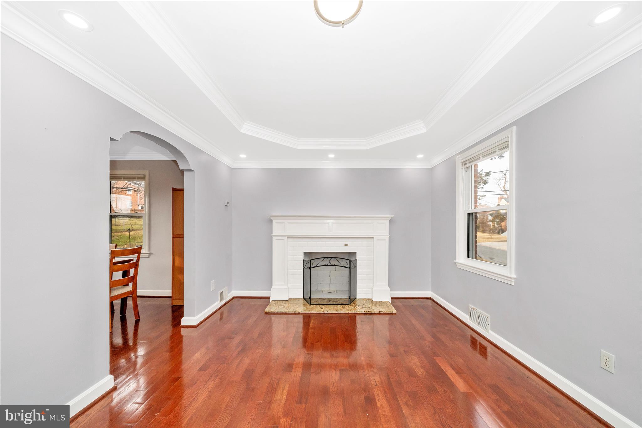821 Rittenhouse Street Hyattsville, MD 20783 - Photo 9 of 59 an empty room with windows and fireplace