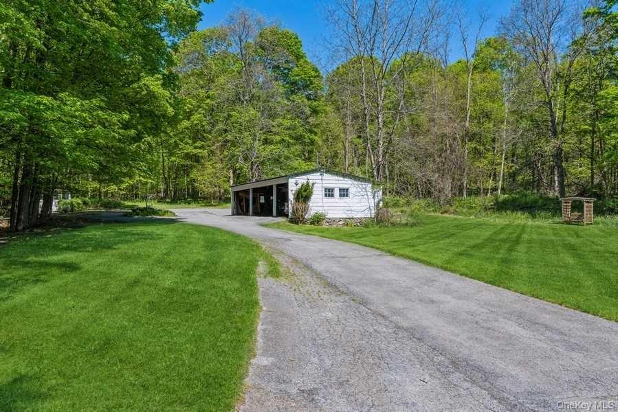1141 Beekman Road Hopewell Junction, NY 12533 - Photo 34 of 36 a view of a backyard with large trees
