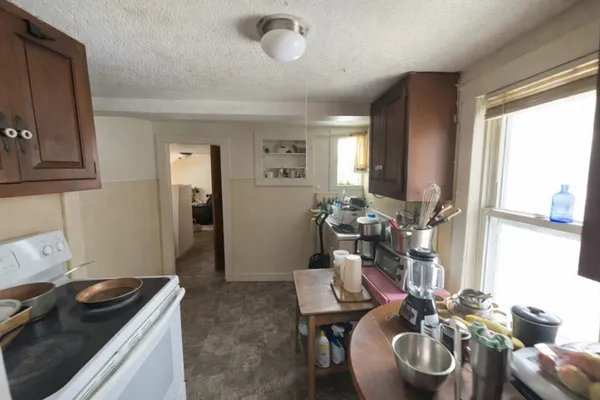 a kitchen with a table and chairs in it