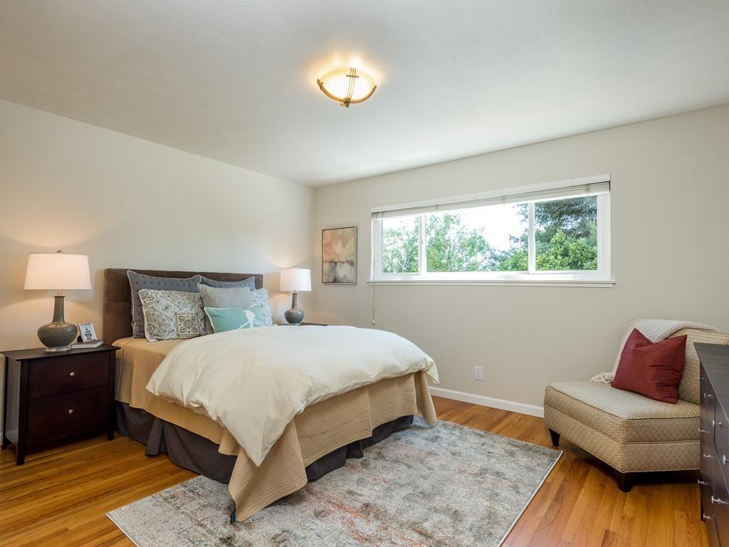 3410 Hillcrest Drive Belmont, CA 94002 - Photo 13 of 26 a bedroom with a bed and a couch