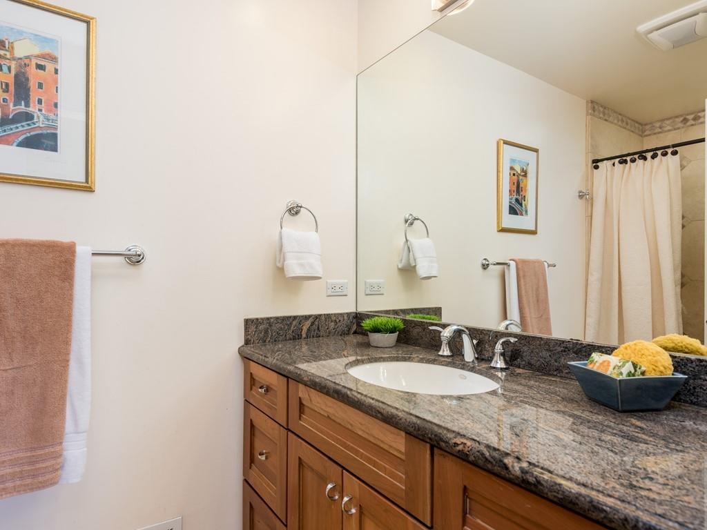 3410 Hillcrest Drive Belmont, CA 94002 - Photo 17 of 26 a bathroom with a granite countertop sink and a mirror