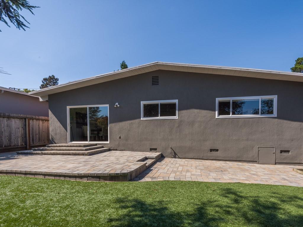 3410 Hillcrest Drive Belmont, CA 94002 - Photo 23 of 26 a front view of a house with a yard