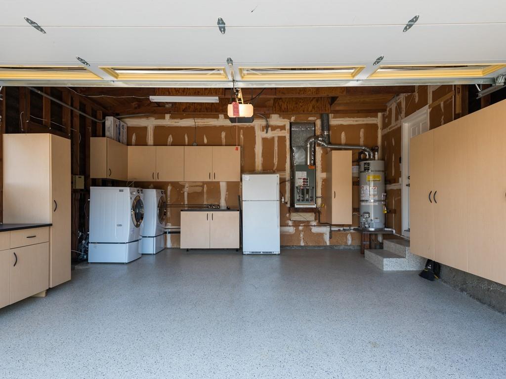 3410 Hillcrest Drive Belmont, CA 94002 - Photo 24 of 26 a view of water heater room with a refrigerator