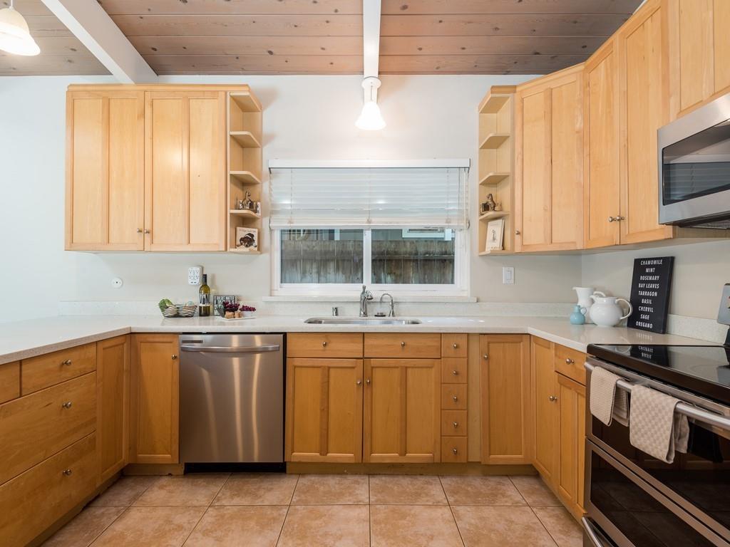 3410 Hillcrest Drive Belmont, CA 94002 - Photo 8 of 26 a kitchen with a sink and cabinets