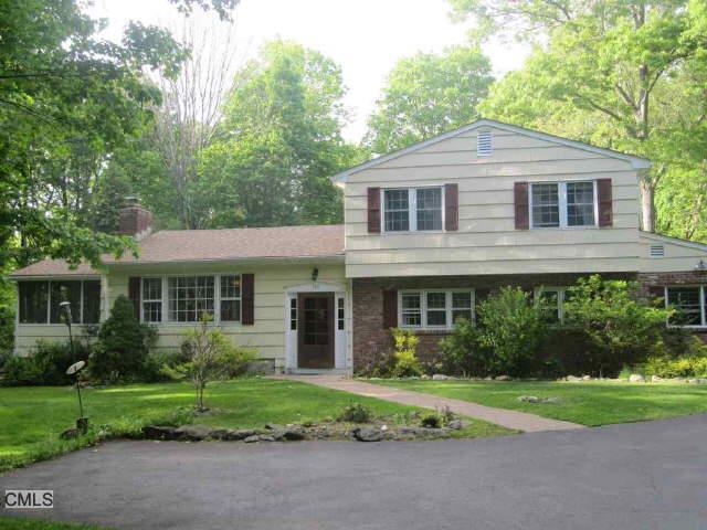 369 Haviland Road Stamford, CT 06903 - Photo 1 of 1 a front view of a house with a yard and green space
