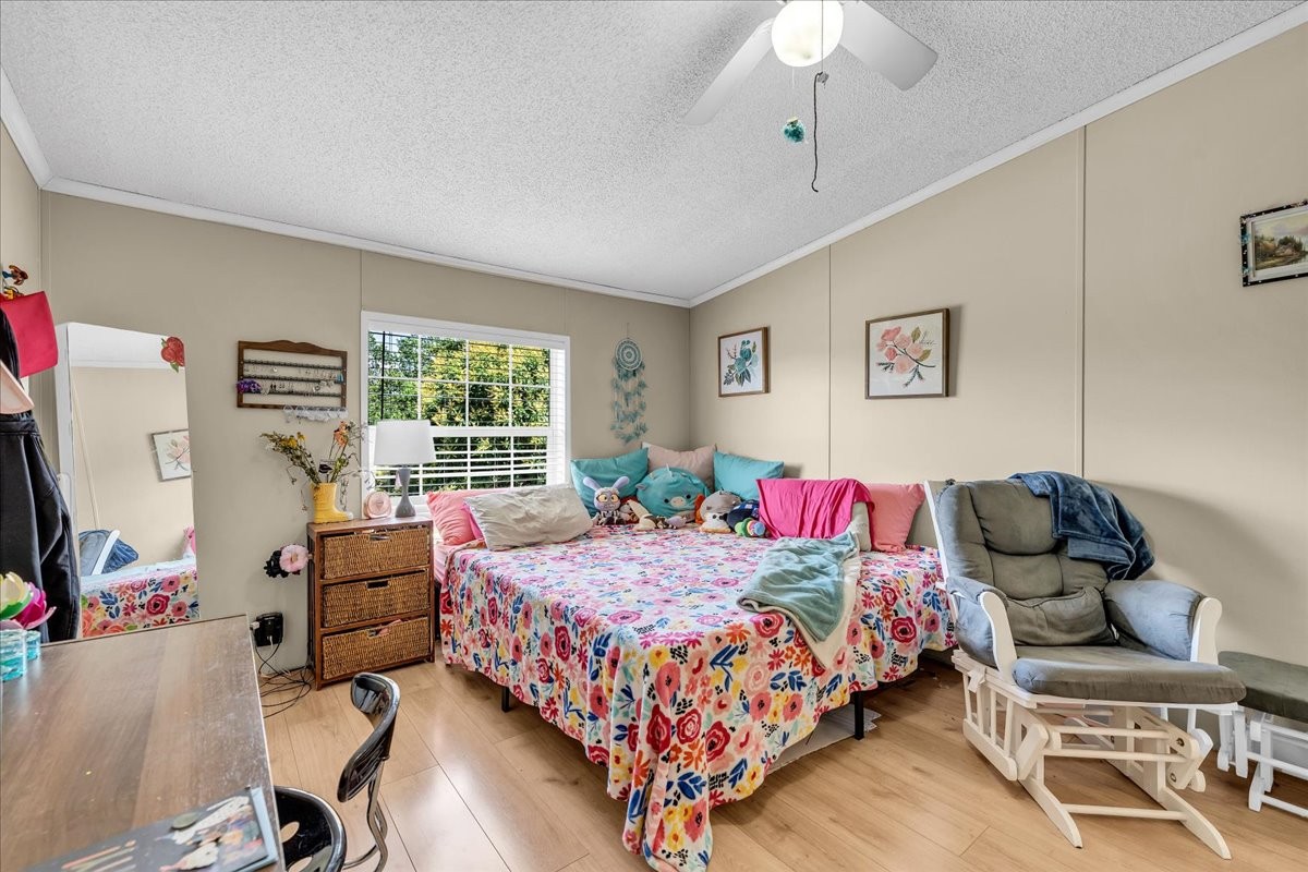 2657 Oak Grove Road Red Boiling Springs, TN 37150 - Photo 28 of 45 a bedroom with a bed and wooden floor