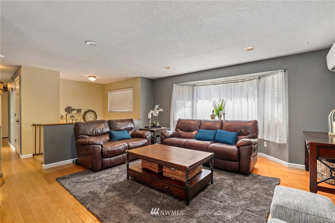 1417 234th Street Southwest Bothell, WA 98021 - Photo 2 of 40 a living room with furniture and a window
