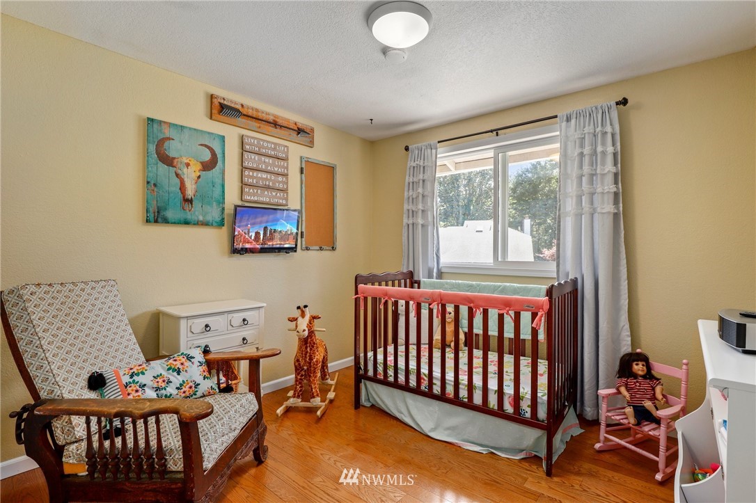 1417 234th Street Southwest Bothell, WA 98021 - Photo 12 of 40 a bedroom with furniture and a window