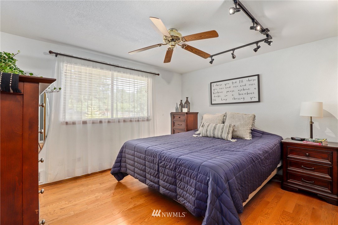 1417 234th Street Southwest Bothell, WA 98021 - Photo 13 of 40 a bedroom with a bed and window