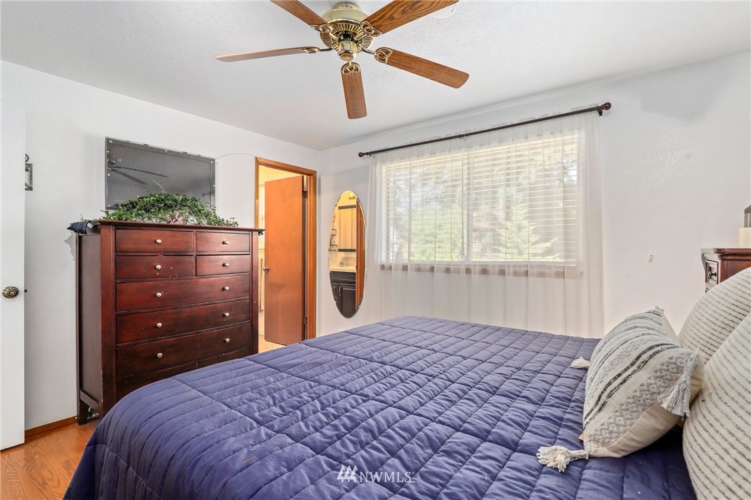 1417 234th Street Southwest Bothell, WA 98021 - Photo 14 of 40 a bedroom with a bed and a window