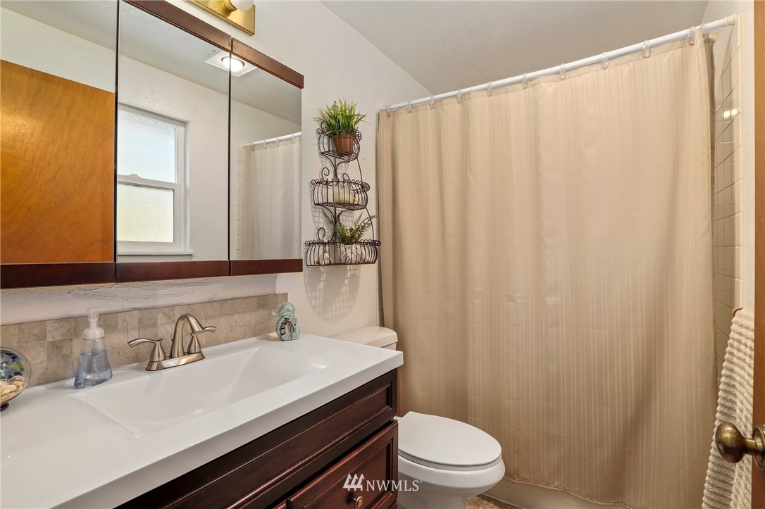 1417 234th Street Southwest Bothell, WA 98021 - Photo 15 of 40 a bathroom with a sink and a mirror