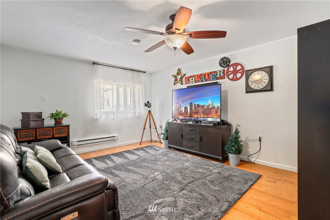 1417 234th Street Southwest Bothell, WA 98021 - Photo 21 of 40 a living room with furniture and a flat screen tv
