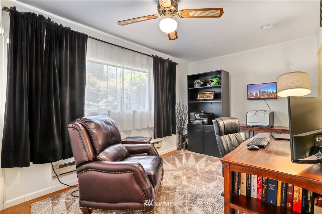 1417 234th Street Southwest Bothell, WA 98021 - Photo 22 of 40 a living room with furniture and a flat screen tv