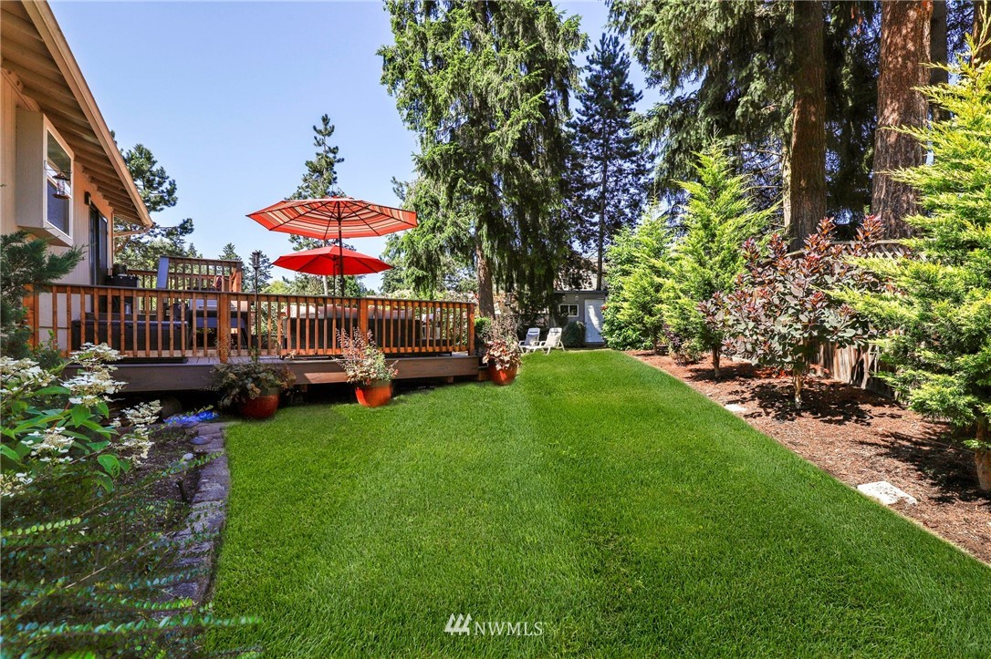 1417 234th Street Southwest Bothell, WA 98021 - Photo 26 of 40 a view of outdoor space yard deck patio and swimming pool