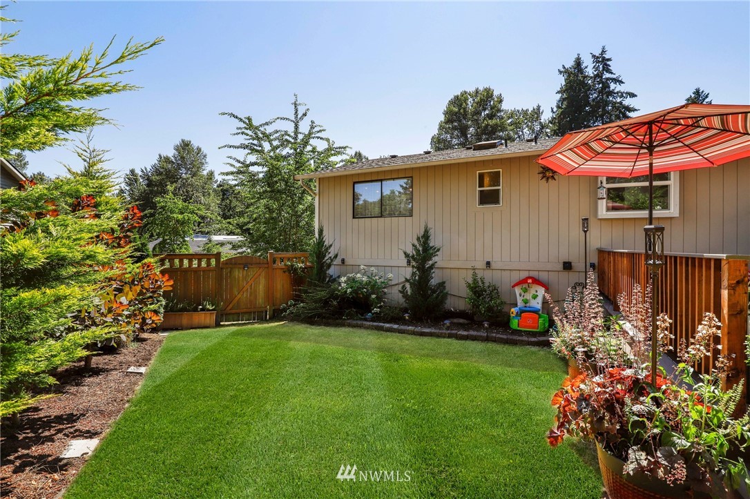 1417 234th Street Southwest Bothell, WA 98021 - Photo 27 of 40 a view of a house with a garden