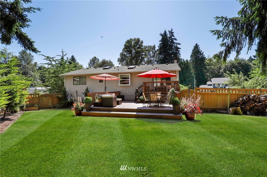 1417 234th Street Southwest Bothell, WA 98021 - Photo 28 of 40 a view of a house with patio swimming pool and furniture