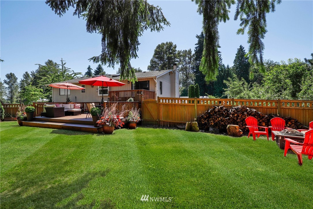 1417 234th Street Southwest Bothell, WA 98021 - Photo 30 of 40 a view of a backyard with a garden and trees
