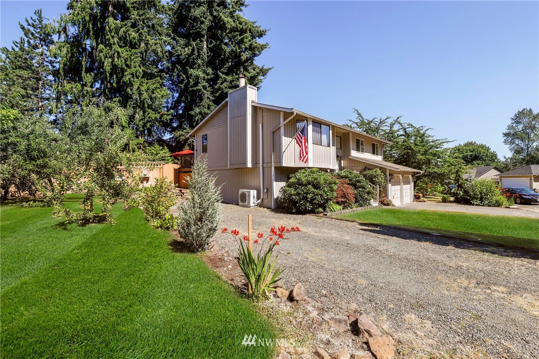 1417 234th Street Southwest Bothell, WA 98021 - Photo 37 of 40 a front view of a house with a yard