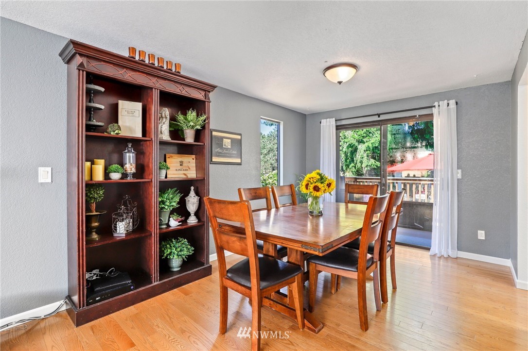 1417 234th Street Southwest Bothell, WA 98021 - Photo 5 of 40 a view of a dining room with furniture window and outside view