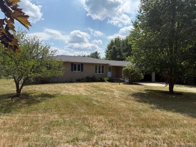 10089 Coldwater Road Flushing, MI 48433 - Photo 13 of 17 Spacious property featuring a brick exterior, a covered entry, and a newly installed shingle roof