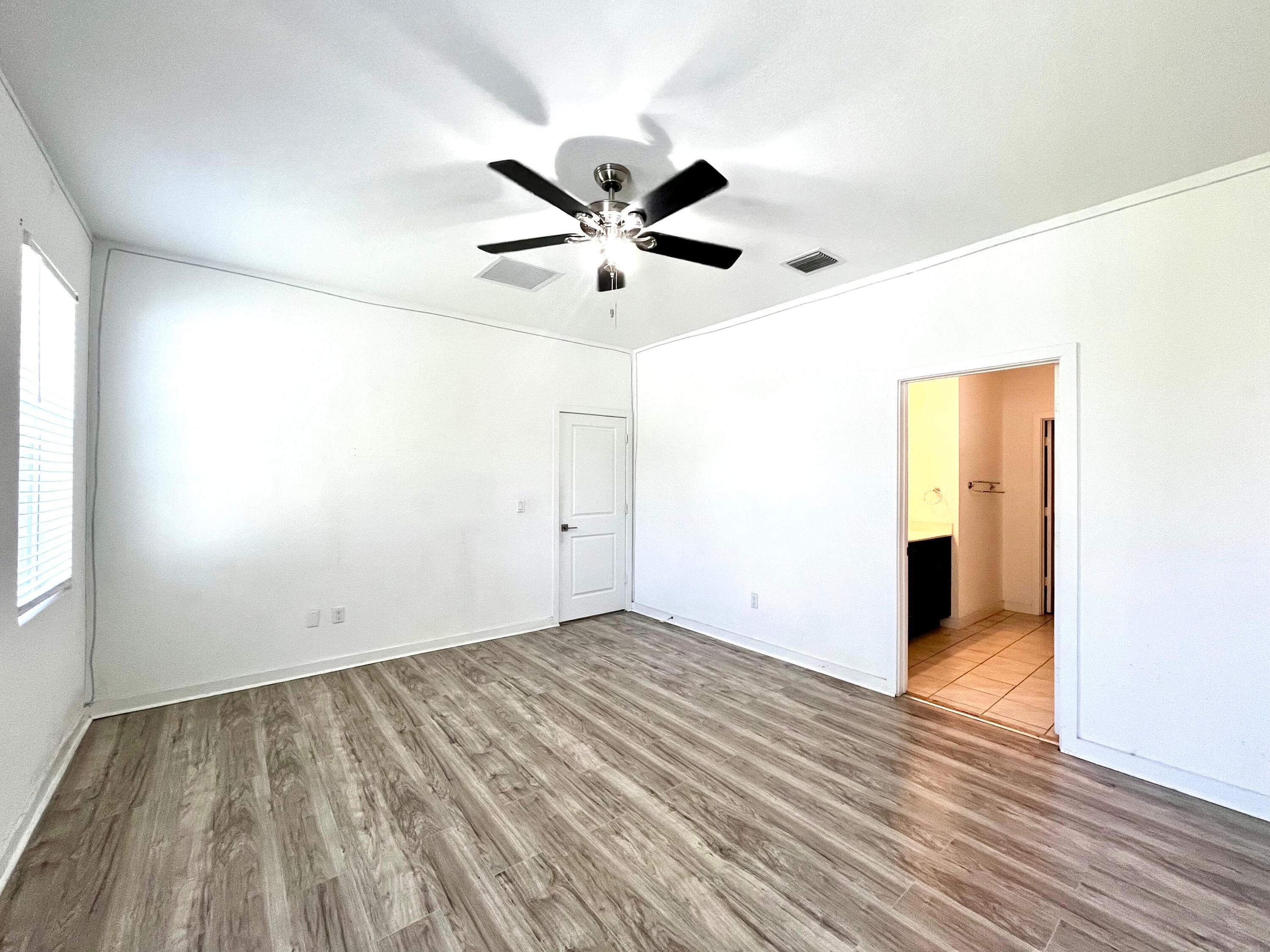 6089 Wildfire Way West Palm Beach, FL 33415 - Photo 11 of 21 wooden floor in an empty room