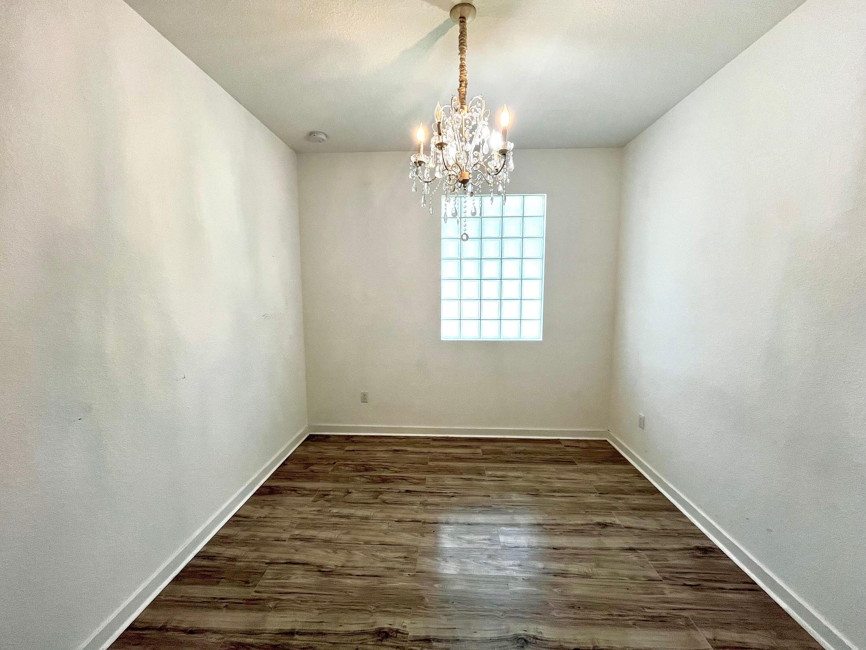 6089 Wildfire Way West Palm Beach, FL 33415 - Photo 14 of 21 en empty room with windows