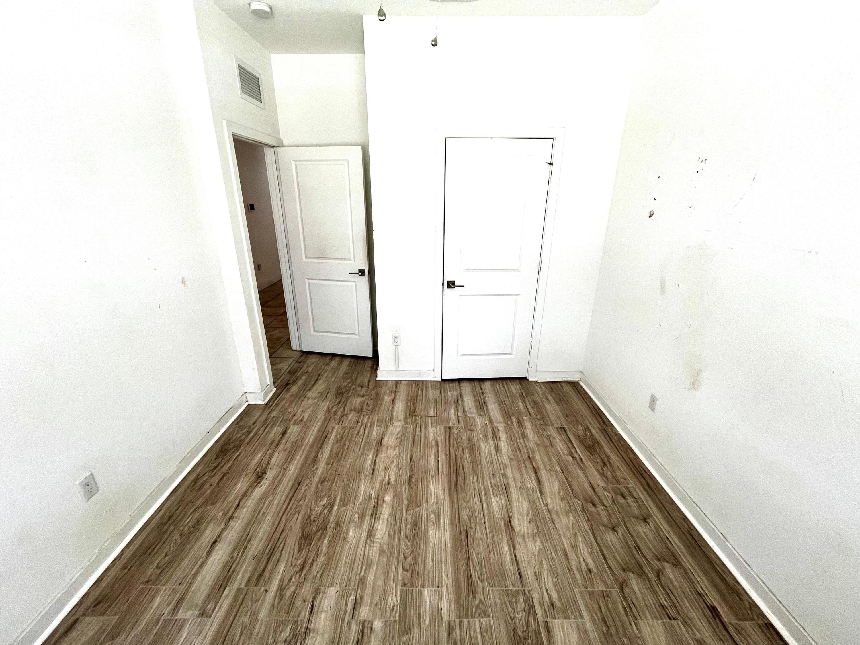 6089 Wildfire Way West Palm Beach, FL 33415 - Photo 20 of 21 a view of a room with wooden floor