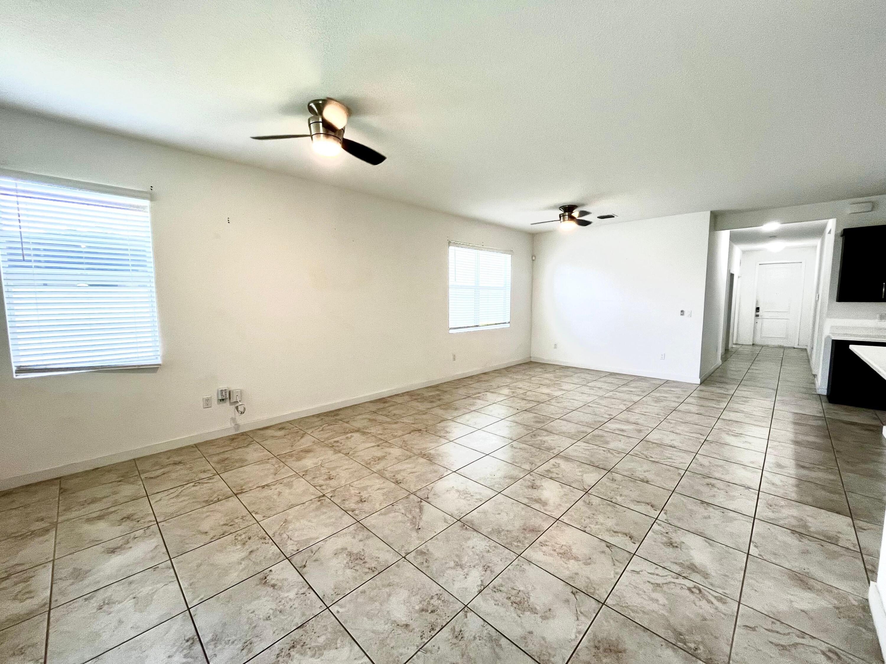 6089 Wildfire Way West Palm Beach, FL 33415 - Photo 10 of 21 a view of an empty room and window