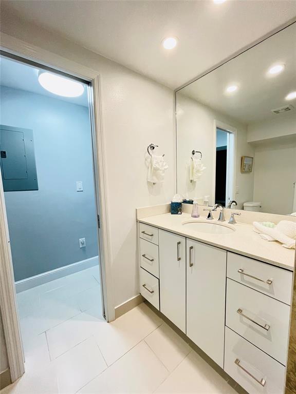 1705 North Riverside Drive, Unit 2 Pompano Beach, FL 33062 - Photo 27 of 60 a bathroom with a double vanity sink and mirror