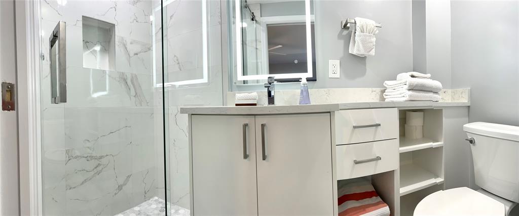 1705 North Riverside Drive, Unit 2 Pompano Beach, FL 33062 - Photo 37 of 60 a bathroom with a sink toilet and shower