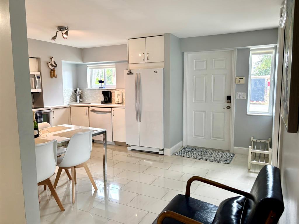 1705 North Riverside Drive, Unit 2 Pompano Beach, FL 33062 - Photo 42 of 60 a living room with furniture and a refrigerator