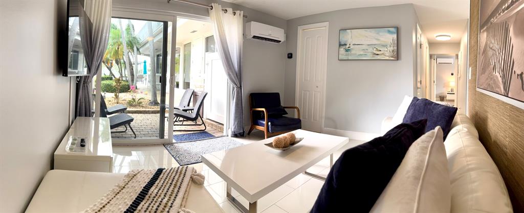 1705 North Riverside Drive, Unit 2 Pompano Beach, FL 33062 - Photo 45 of 60 a living room with furniture and a fireplace