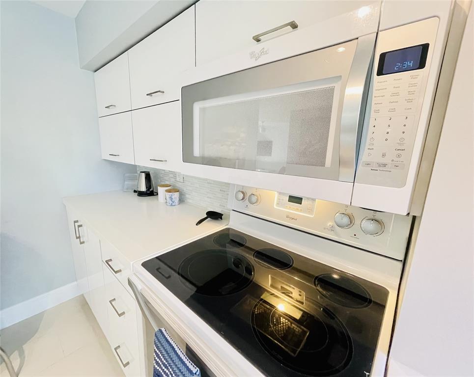 1705 North Riverside Drive, Unit 2 Pompano Beach, FL 33062 - Photo 9 of 60 a bathroom with a sink and a mirror