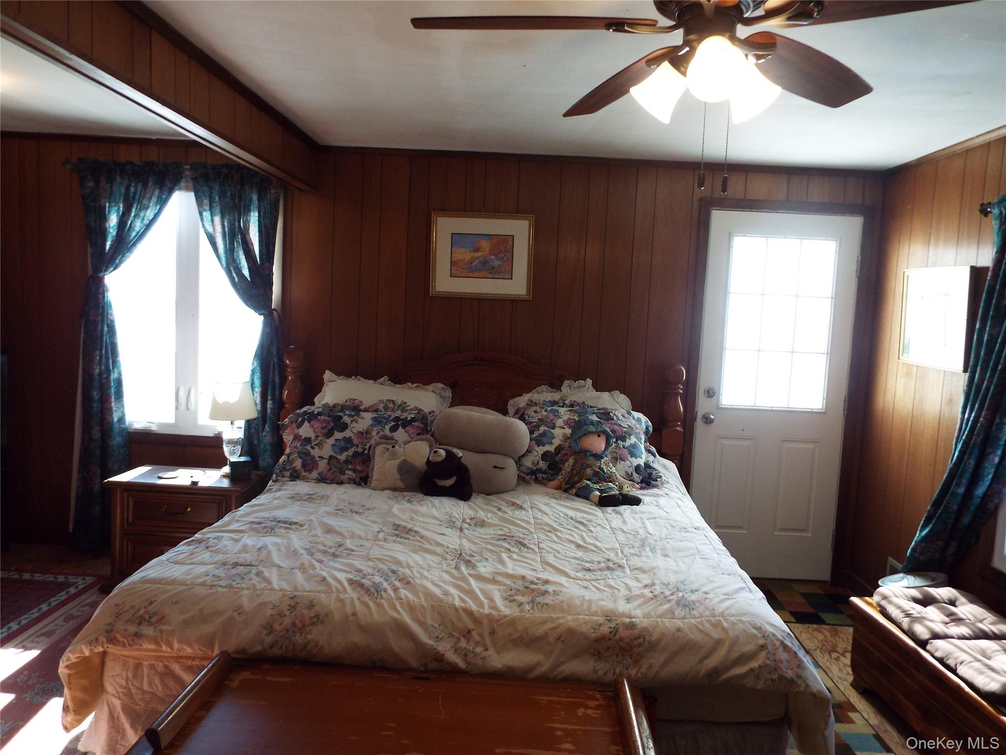 2492 State Rt 17B Bethel, NY 12726 - Photo 16 of 26 a bedroom with a bed and a chandelier