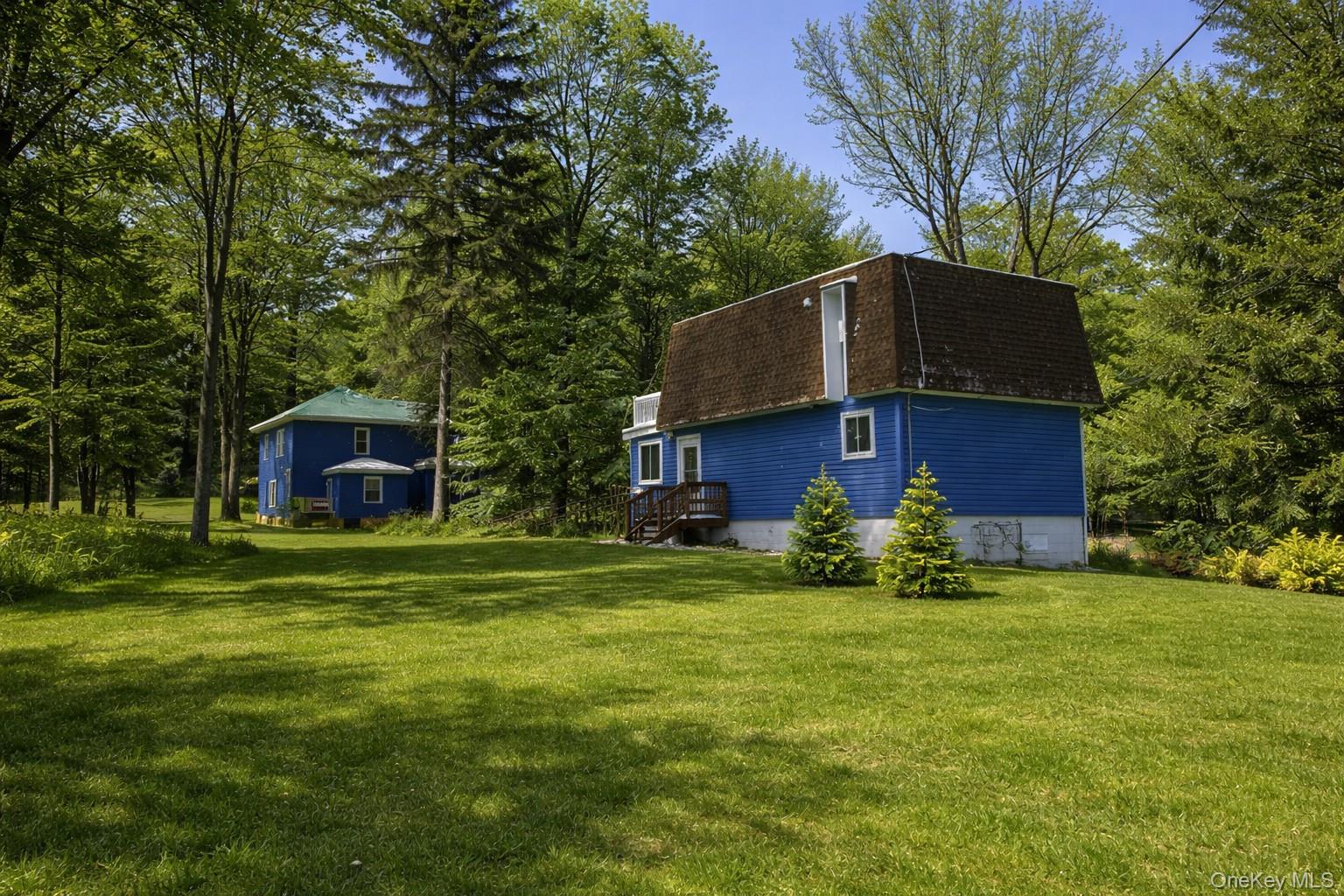 2492 State Rt 17B Bethel, NY 12726 - Photo 2 of 26 a house view with a sitting space and garden