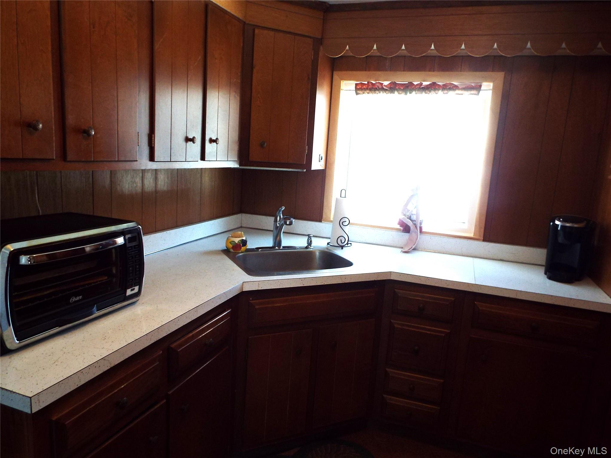 2492 State Rt 17B Bethel, NY 12726 - Photo 5 of 26 a kitchen with a sink and cabinets