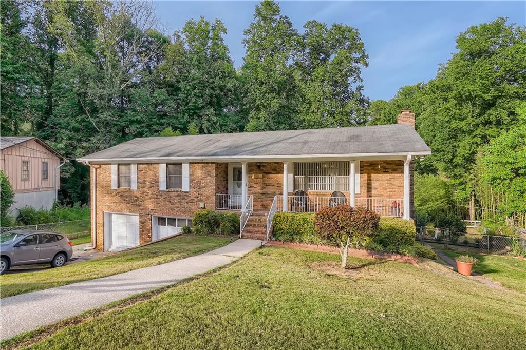 1653 Pine Glen Circle Decatur, GA 30035 - Photo 1 of 1 a view of a house with a yard and sitting area