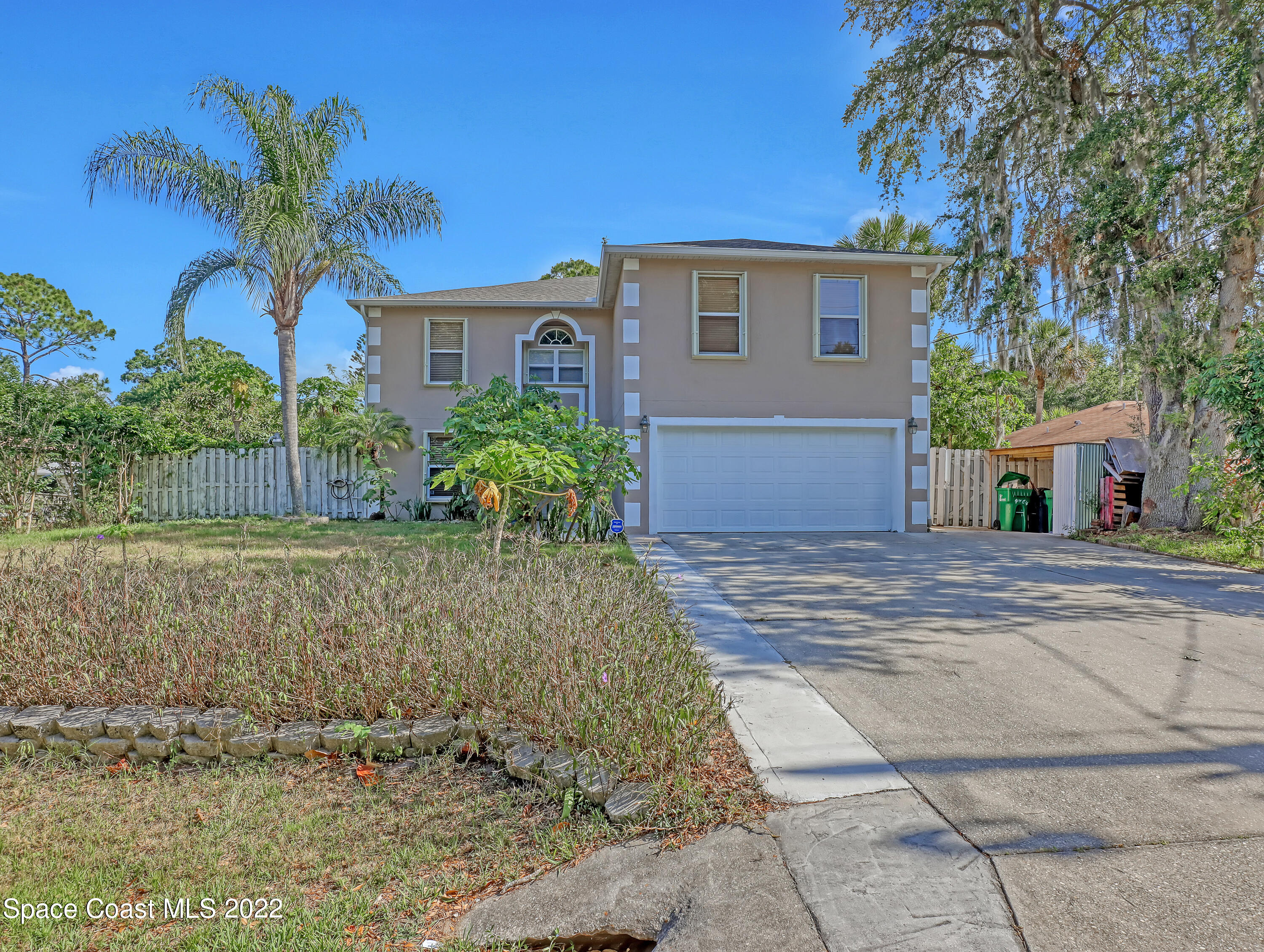 4764 Doreen Road Cocoa, FL 32927 - Photo 1 of 54 a front view of a house with a yard