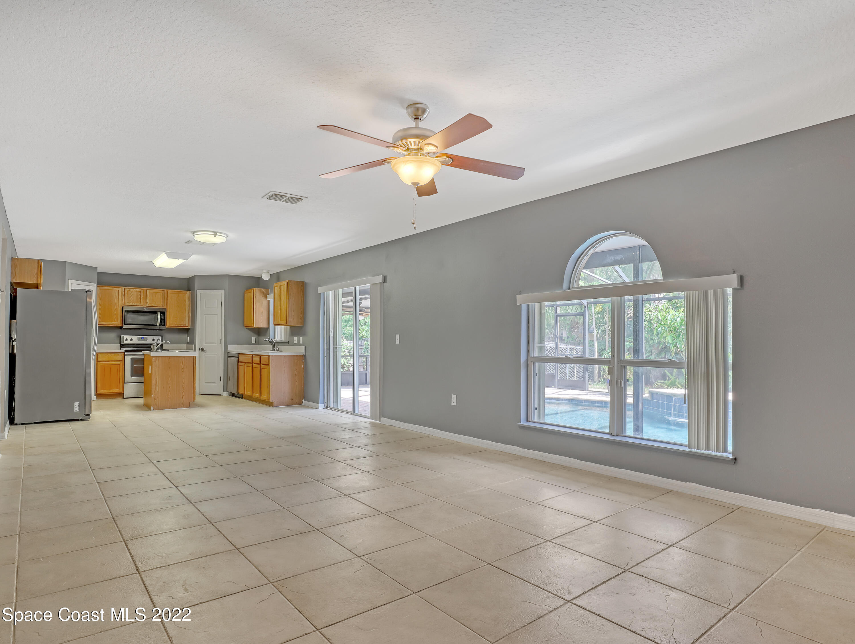 4764 Doreen Road Cocoa, FL 32927 - Photo 13 of 54 a view of an empty room with a window