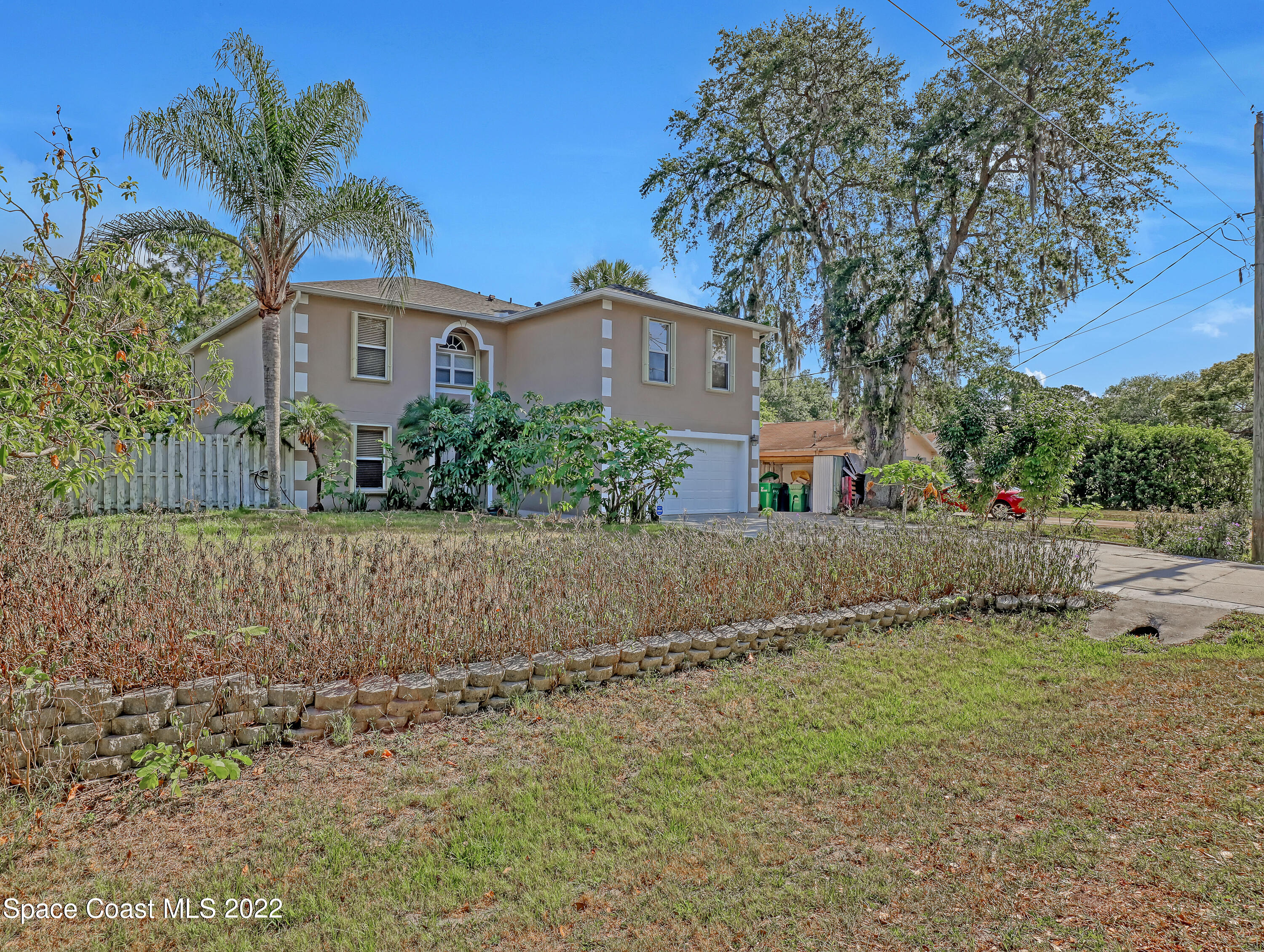 4764 Doreen Road Cocoa, FL 32927 - Photo 2 of 54 a front view of a house with a yard