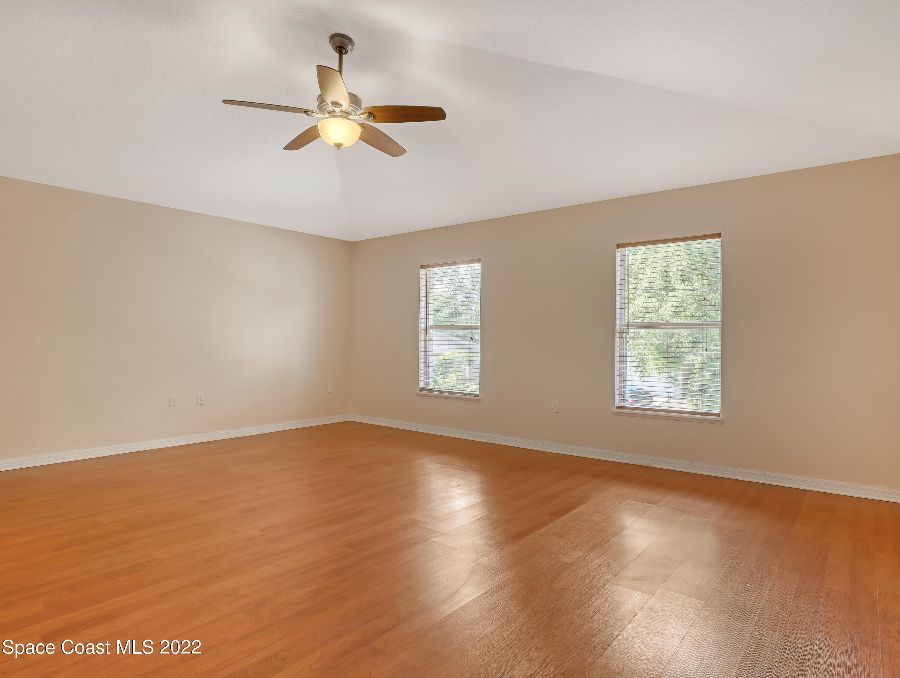 4764 Doreen Road Cocoa, FL 32927 - Photo 23 of 54 a view of an empty room with wooden floor and a window