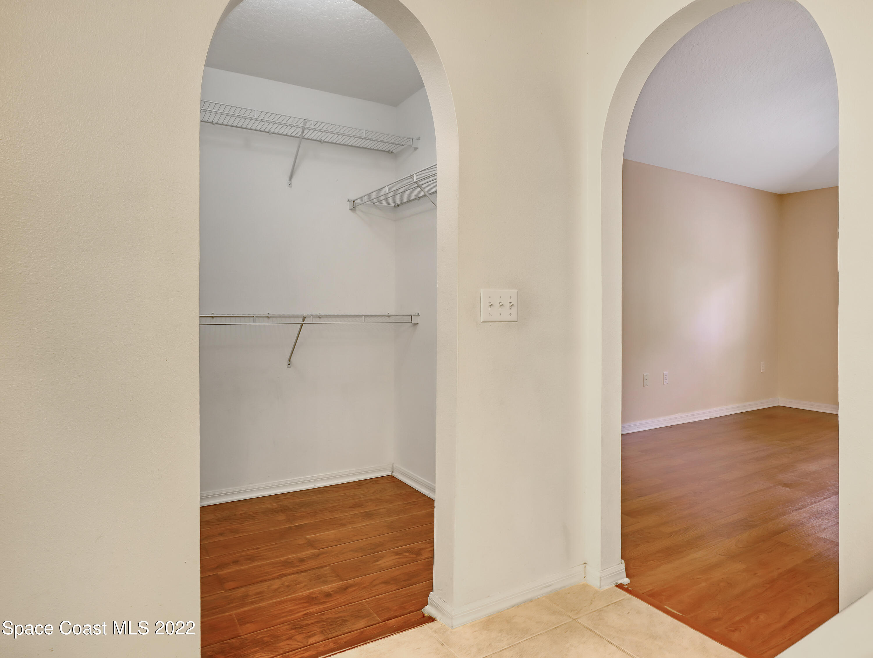 4764 Doreen Road Cocoa, FL 32927 - Photo 28 of 54 a view of walk in closet with empty racks