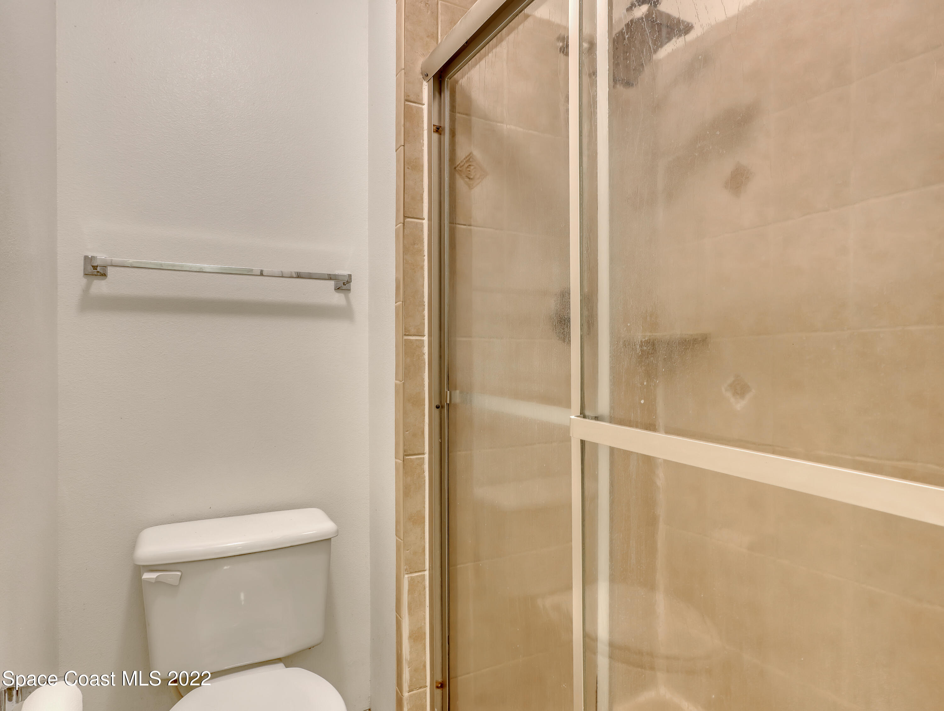 4764 Doreen Road Cocoa, FL 32927 - Photo 29 of 54 a bathroom with a toilet and a shower