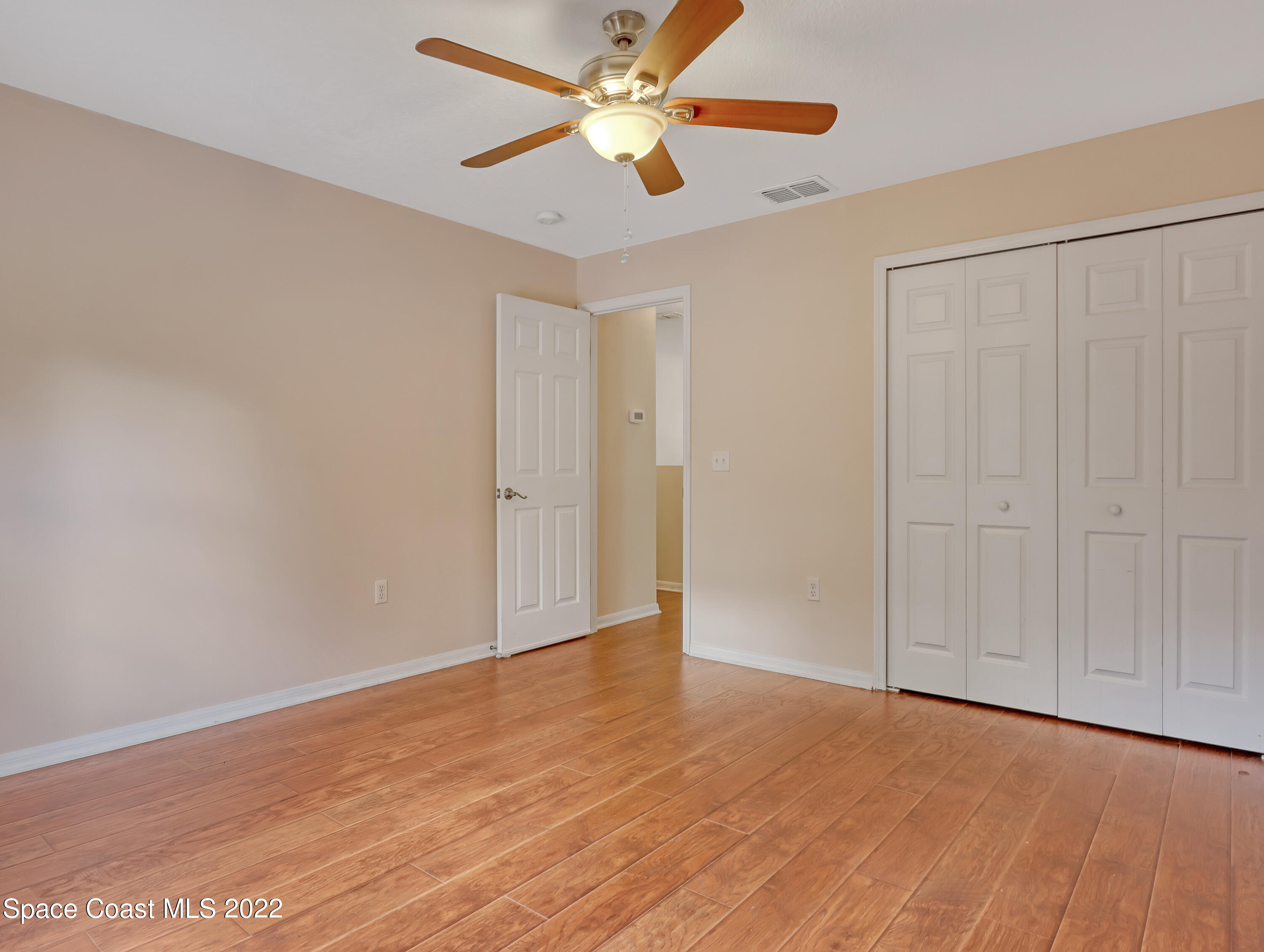4764 Doreen Road Cocoa, FL 32927 - Photo 31 of 54 wooden floor in an empty room