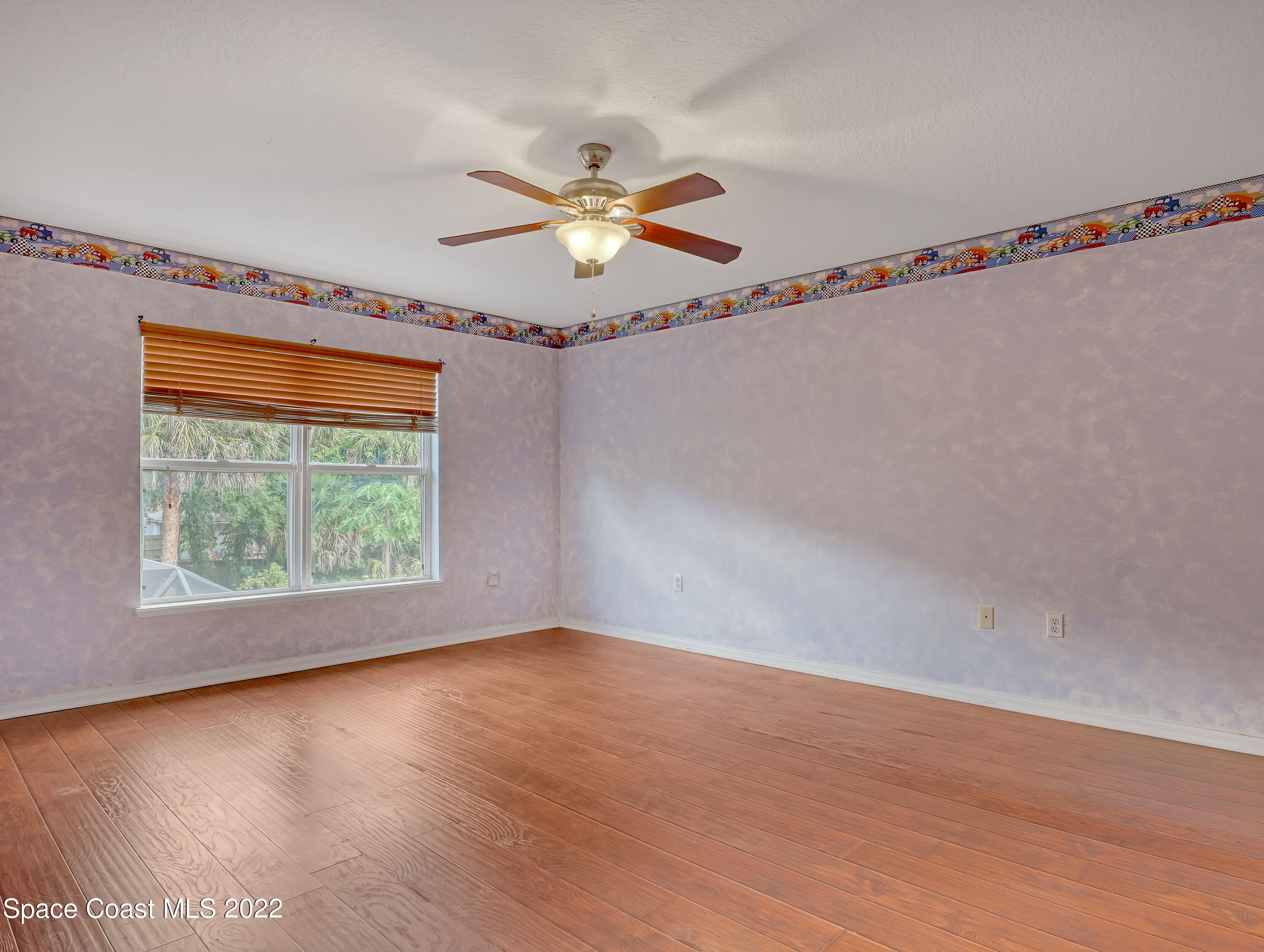 4764 Doreen Road Cocoa, FL 32927 - Photo 33 of 54 a view of room with hardwood floor and fan