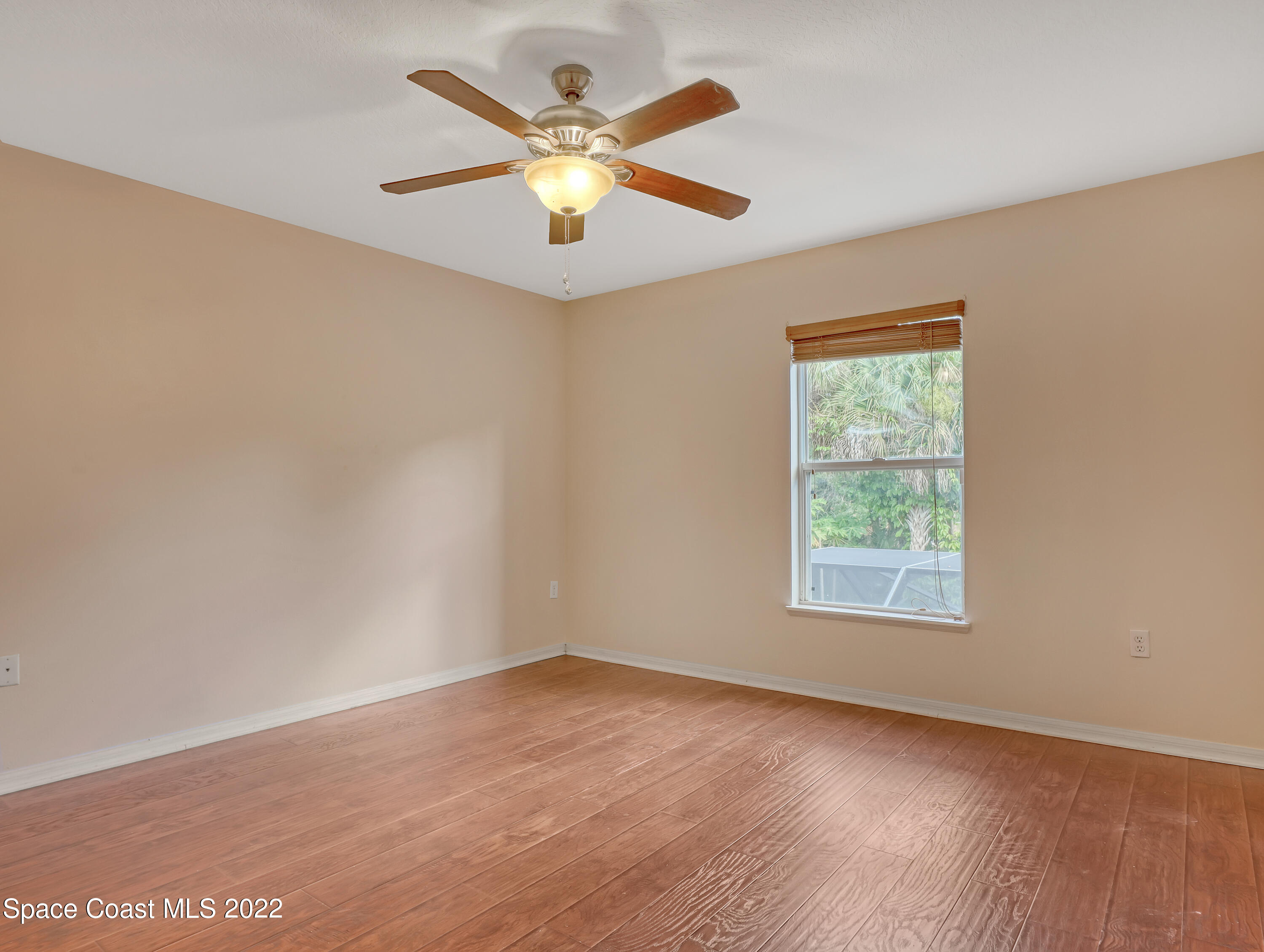 4764 Doreen Road Cocoa, FL 32927 - Photo 35 of 54 an empty room with a window and a fan